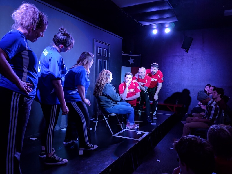 Volunteer Player Ashely being wooed during a game of Cassanova 